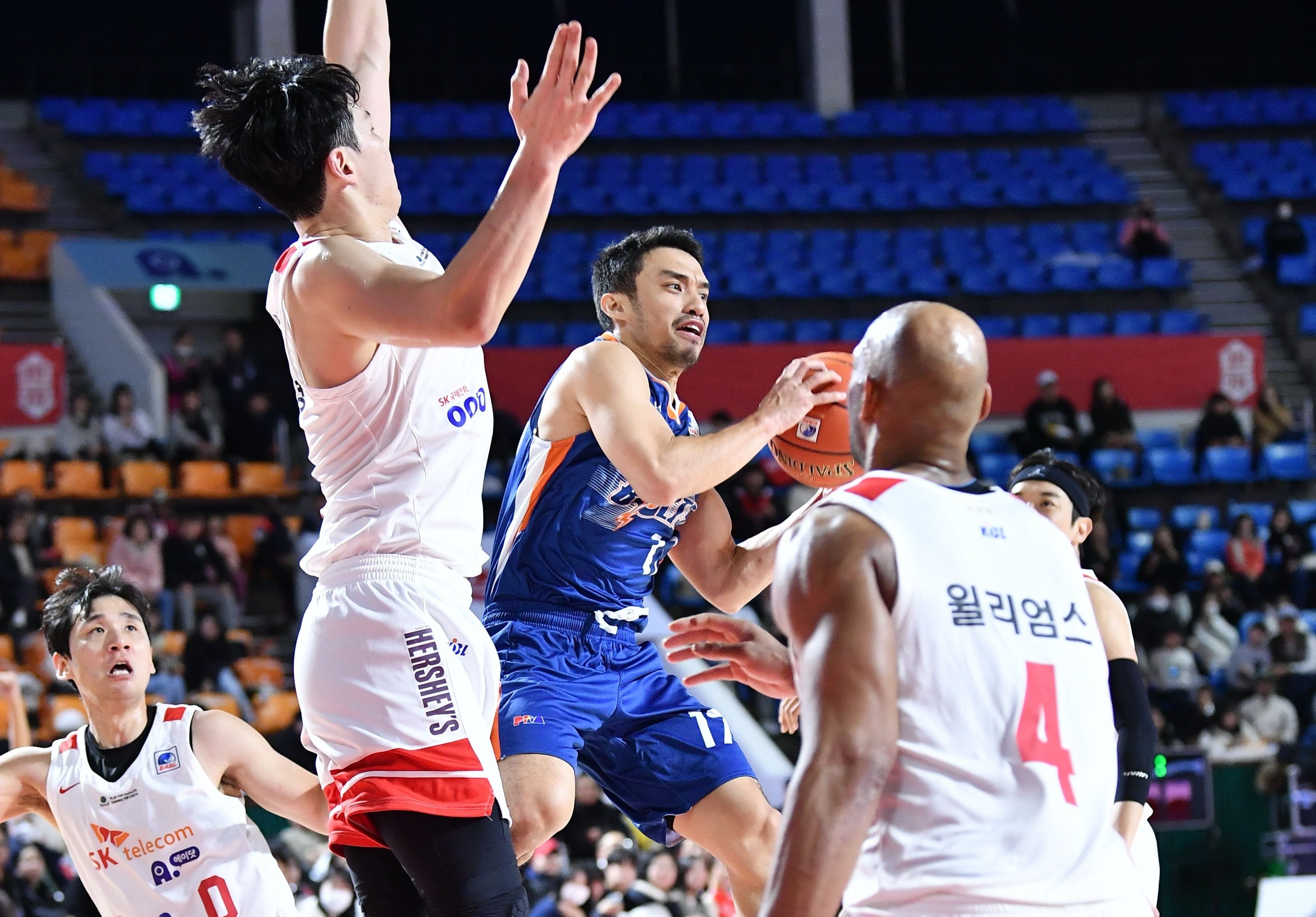 Meralco guard Anjo Caram tries to drive past two Korean defenders in their EASL game. Handout/EASL.