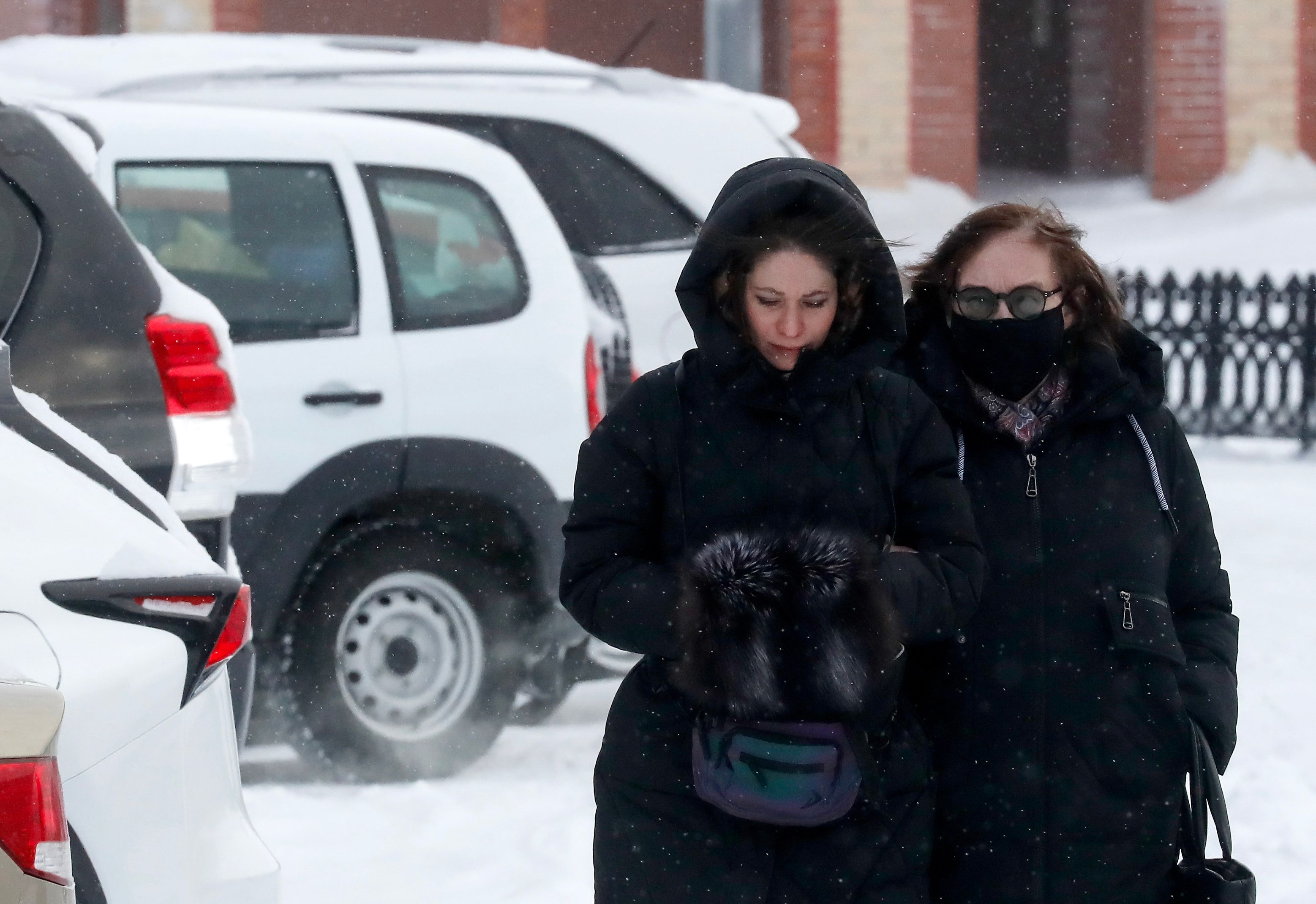 Lyudmila Navalnaya (R), mother of Alexei Navalny, walks accompanied by lawyers after visiting the Investigative Committee in Salekhard, Yamalo-Nenets region, Russia, February 19, 2024. Anatoly Maltsev, EPA-EFE.