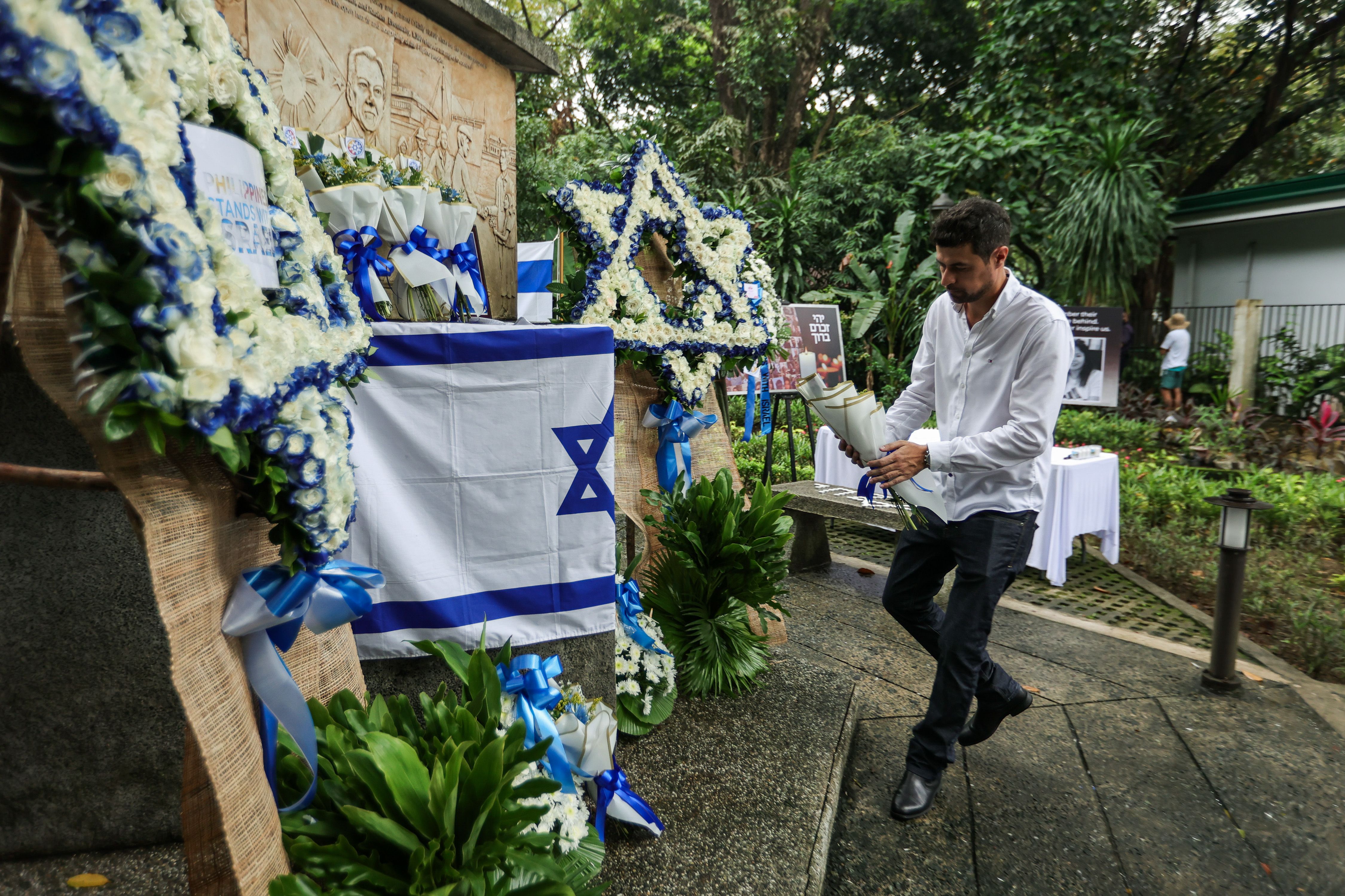 Members of the International Christian Embassy Jerusalem (ICEJ) and the Filipino-Jewish community offer prayers and flowers in solidarity with Israel at the Philippine-Israel Friendship Marker at the Quezon Memorial Circle on October 18, 2023. Maria Tan, ABS-CBN News/File