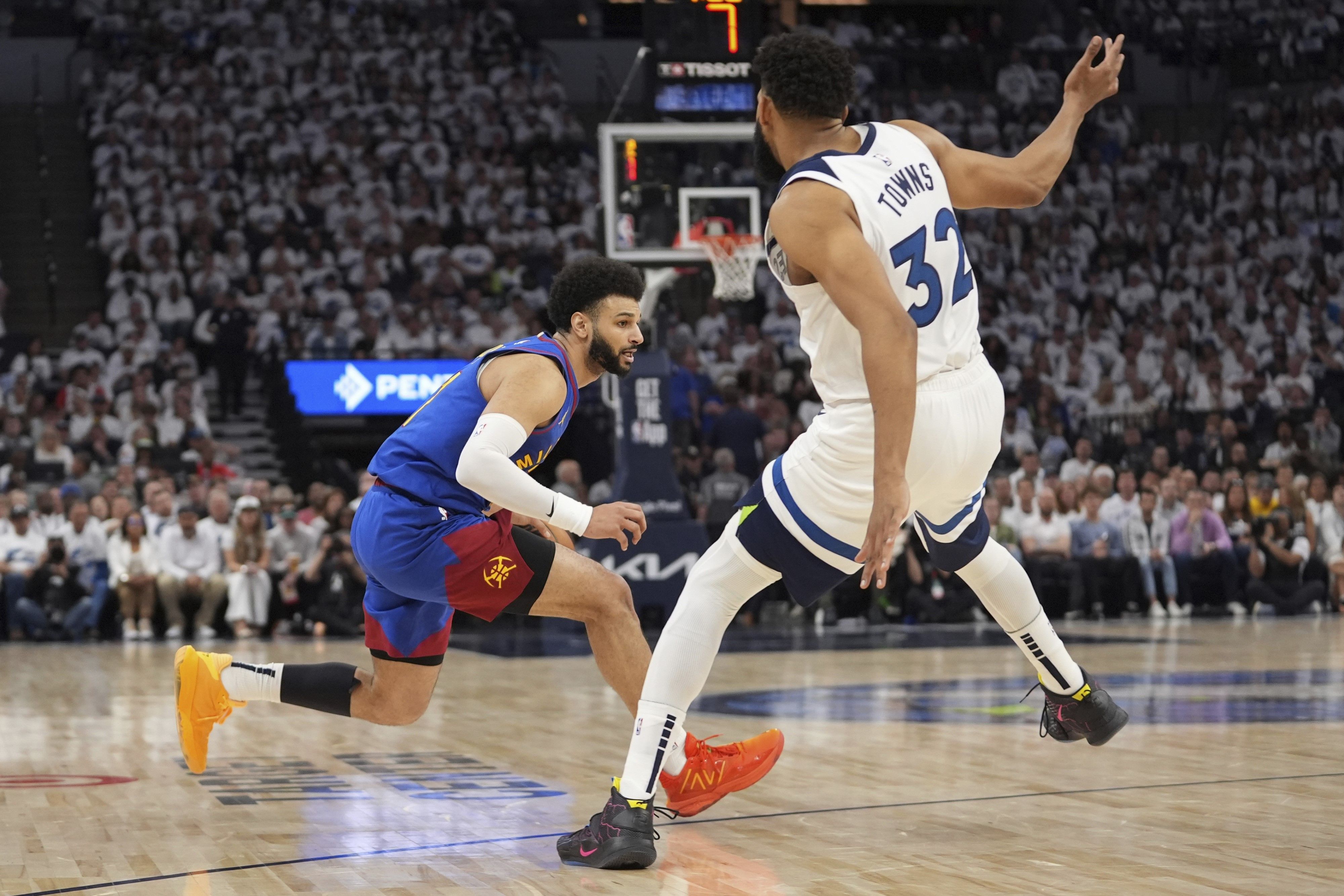Denver Nuggets guard Jamal Murray, left, works toward the basket as Minnesota Timberwolves center Karl-Anthony Towns (32) defends during the first half of Game 3 of an NBA basketball second-round playoff series, Friday, May 10, 2024, in Minneapolis. Abbie Parr, AP Photo
