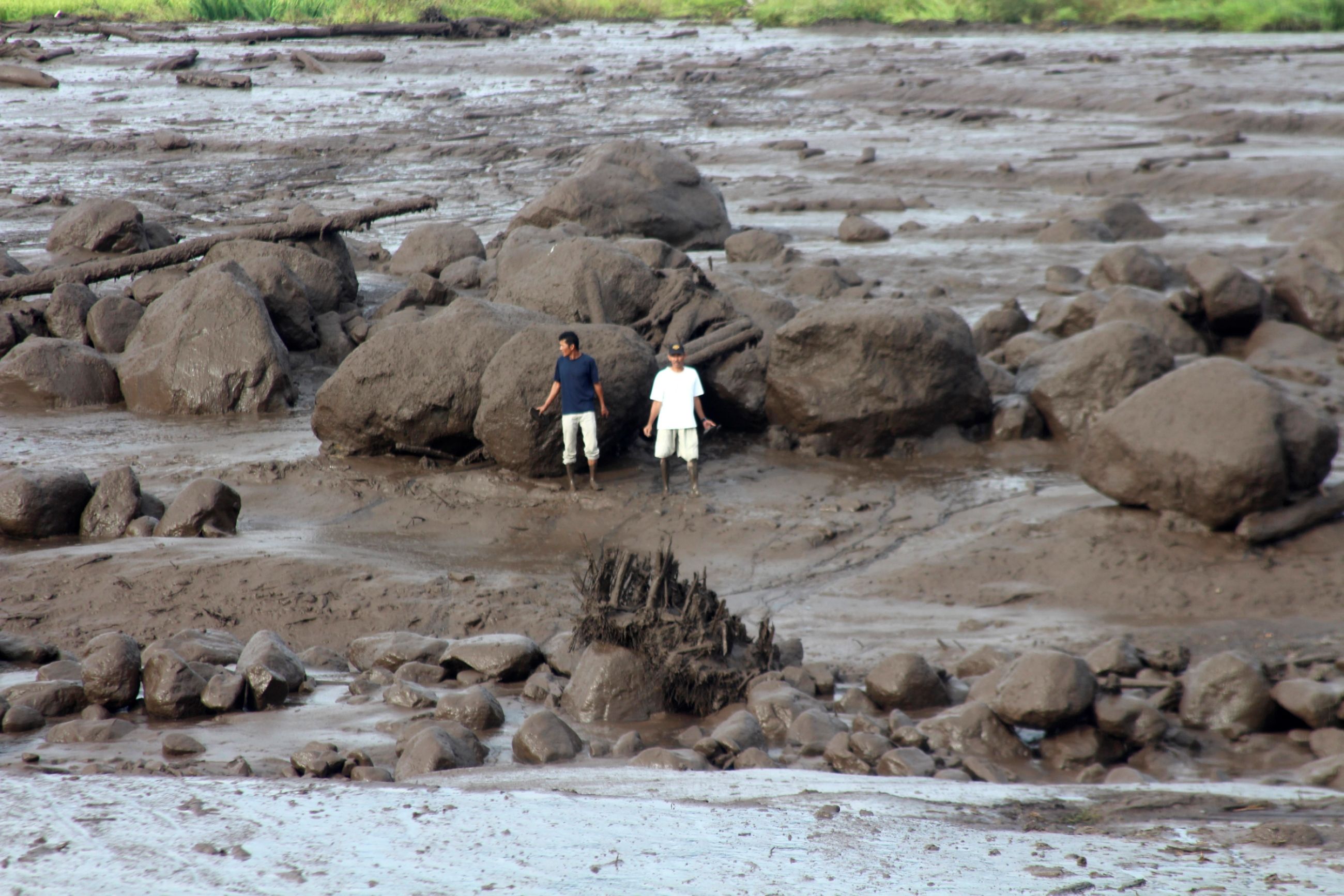 People inspect an area affected by flash flood in Agam, West Sumatra, Indonesia, Sunday, May 12, 2024. Heavy rains and torrents of cold lava and mud rushing down a volcano on Indonesia’s Sumatra island have triggered flash floods that killed more than a dozen of people and injured several others, officials said Sunday. Ali Nayaka, AP Photo