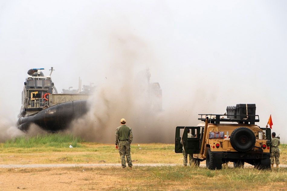 US personnel directs an approaching landing craft air cushion (LCAC) to the beach at Subic Bay Freeport, as the Philippines and the United States kick off their largest joint military exercise. Jun Dumaguing, ABS-CBN News/file