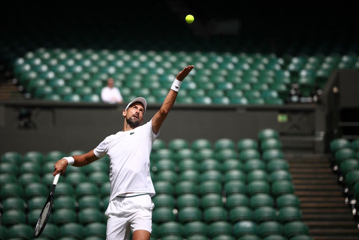 Serbia's Novak Djokovic attends a warm up session on centre court at the All England Lawn Tennis Club, in west London on June 27, 2024, the week before the Wimbledon Championships tennis tournament is due to start on July 1. Henry Nicholls, AFP