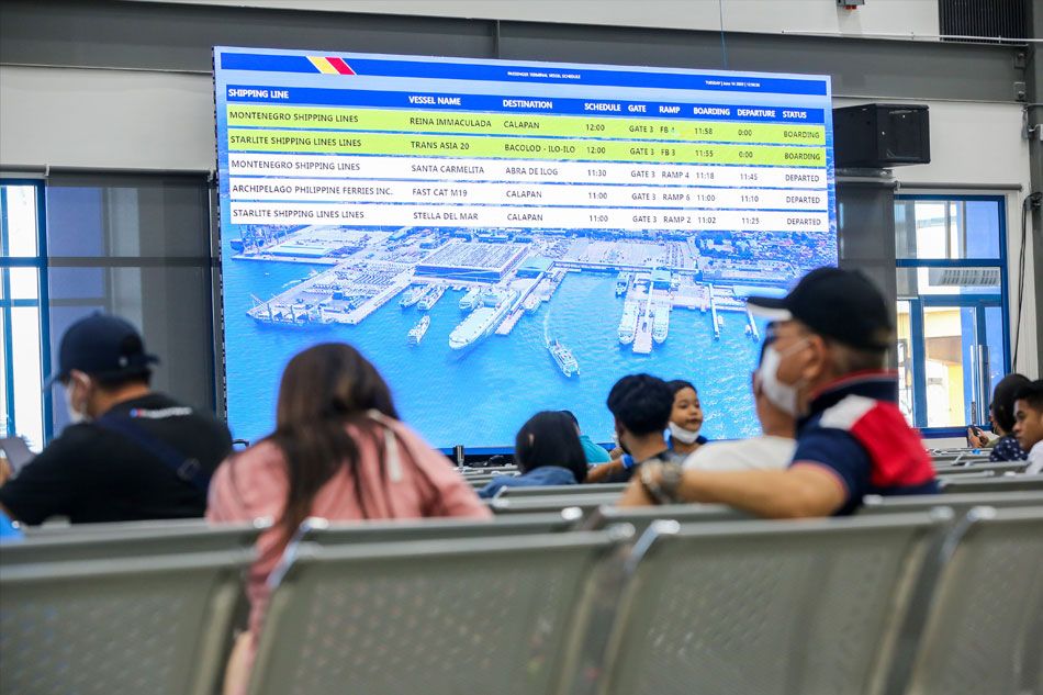 Travelers enter the upgraded Integrated Passenger Terminal Building of the Port of Batangas in Batangas City, on June 14, 2022. The 15,000 sqm port features fully air-conditioned lounges and PWD-friendly facilities for a more convenient experience for passengers. Jonathan Cellona, ABS-CBN News