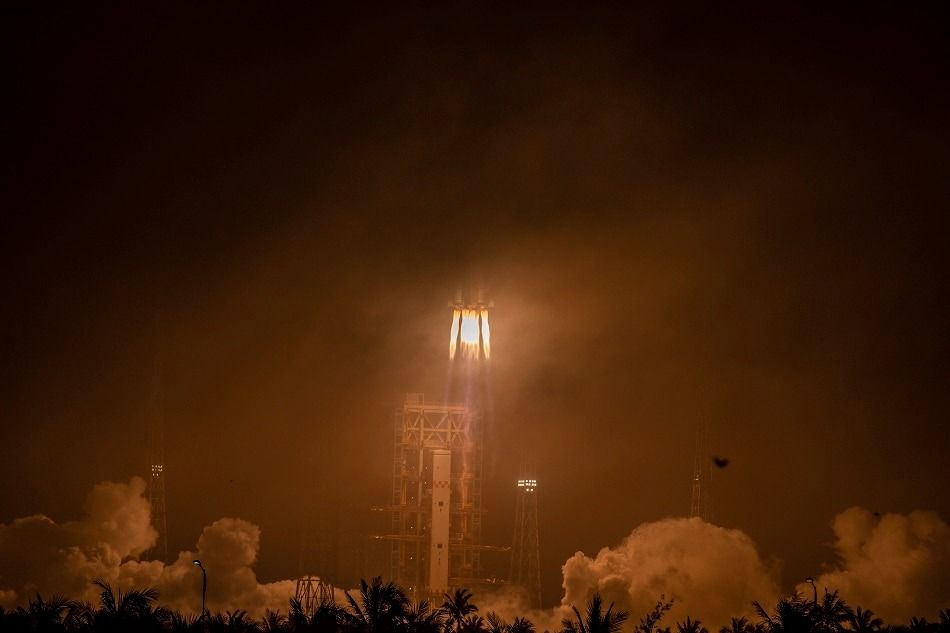 A Long March-7 rocket carrying cargo spacecraft lifts off from the Wenchang Space Launch Center, in southern China's Hainan province on May 10, 2022. CNS / AFP/file