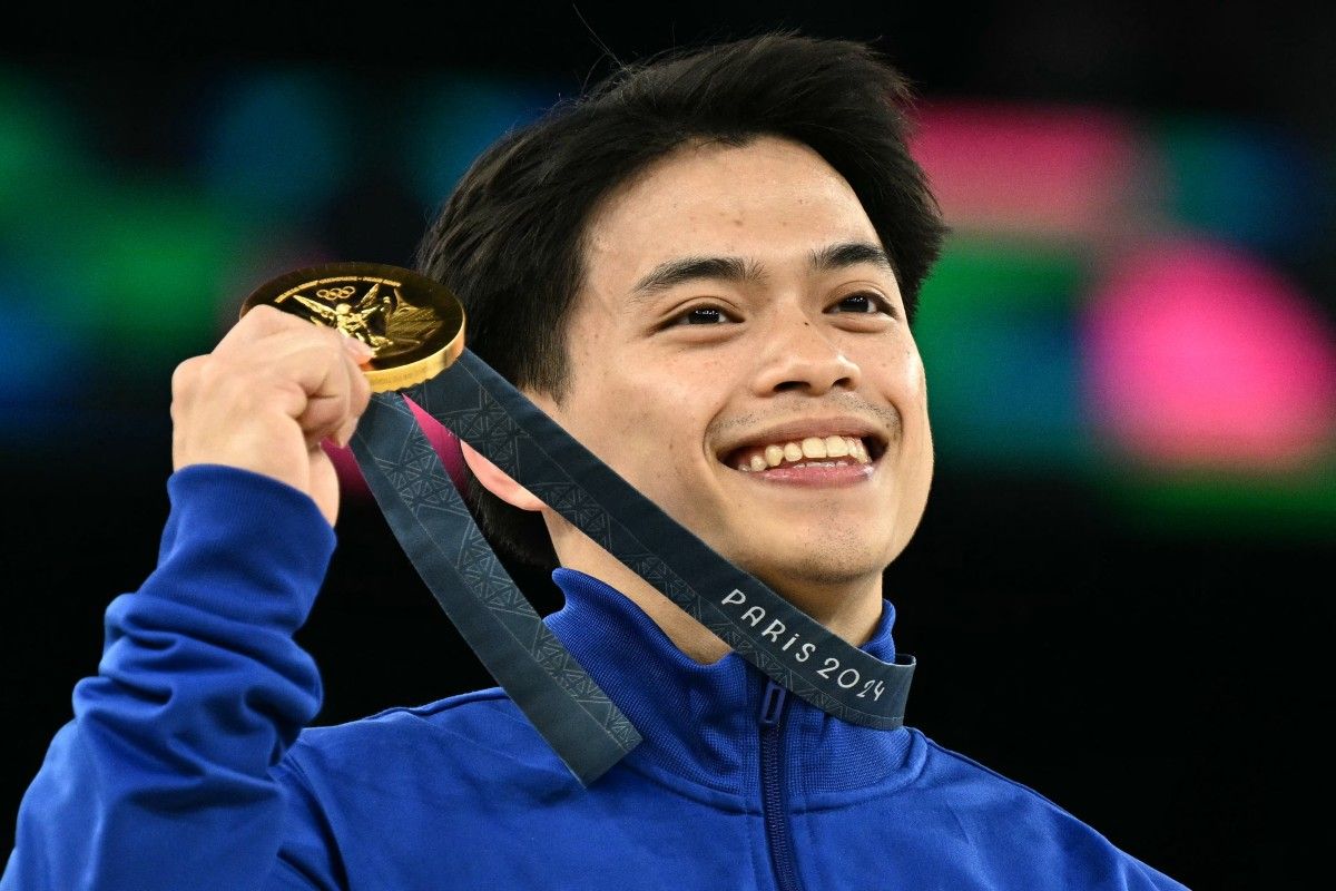 Philippines' Carlos Edriel Yulo poses with his gold medal during the podium ceremony for the artistic gymnastics men's vault event of the Paris 2024 Olympic Games at the Bercy Arena in Paris, on August 4, 2024. Lionel Bonaventure, AFP/File