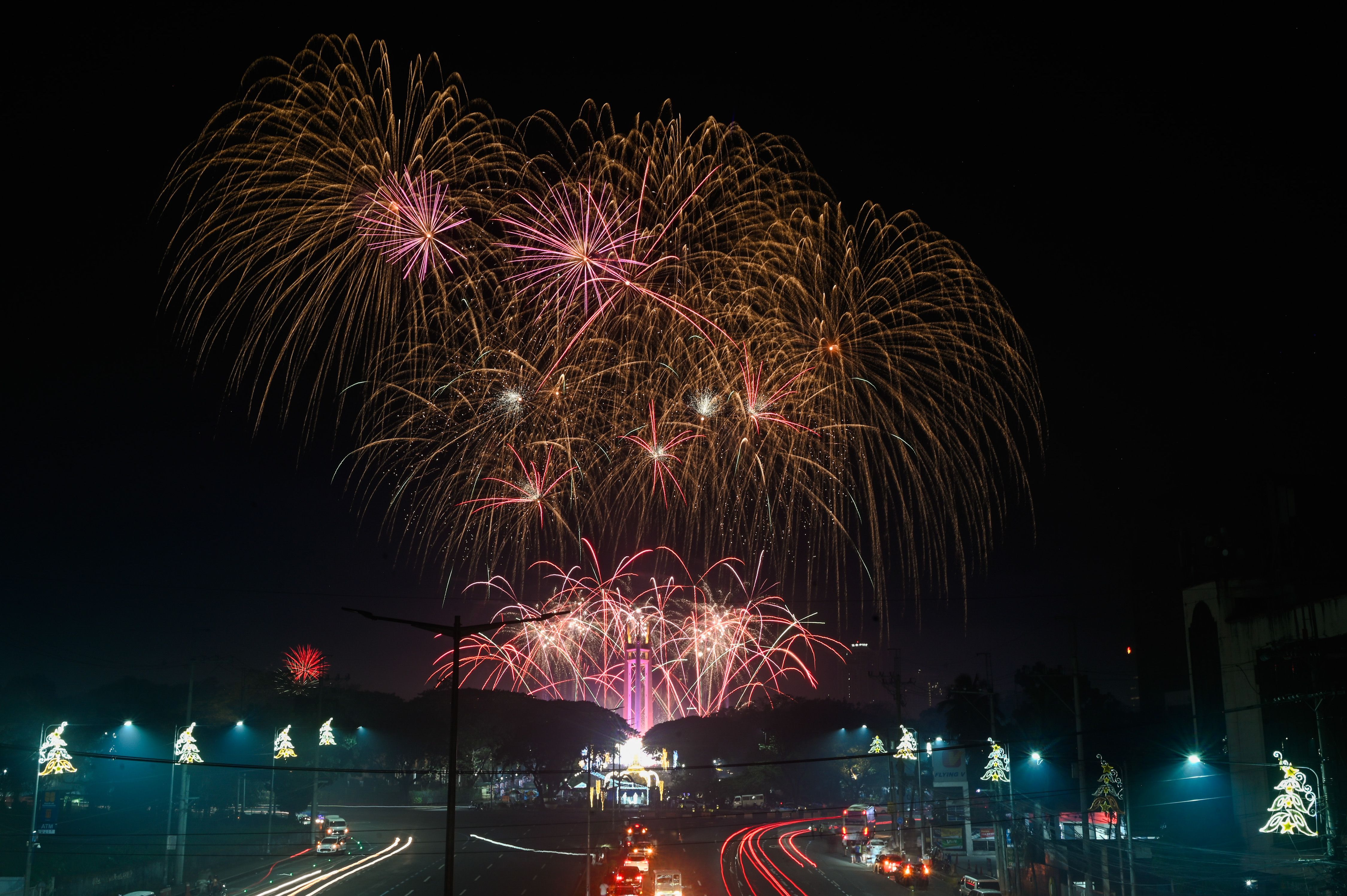 A fireworks display, lasting 10 minutes, lights up the sky during the New Year’s eve celebration at the Quezon Memorial Circle. Maria Tan, ABS-CBN News/File
