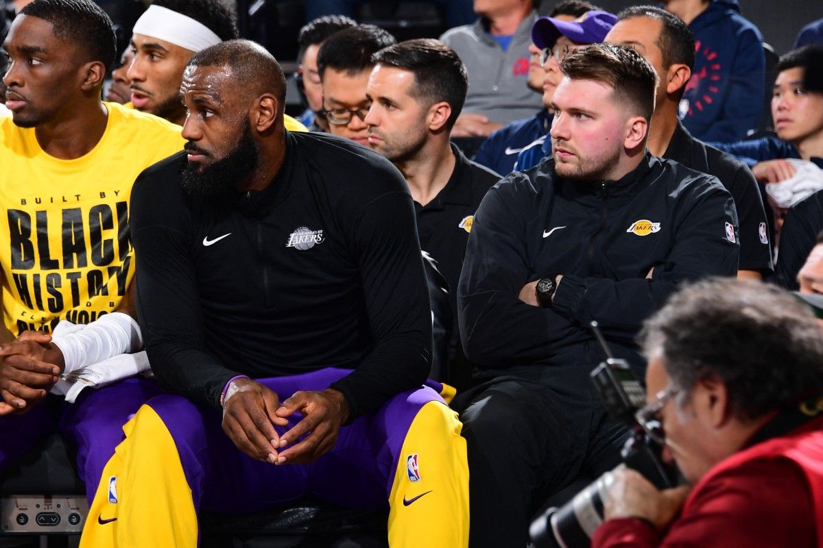 LeBron James #23 and Luka Doncic #77 of the Los Angeles Lakers looks on during the game against the LA Clippers on February 4, 2025 at Intuit Dome in Los Angeles, California. Adam Pantozzi, NBAE via Getty Images/AFP