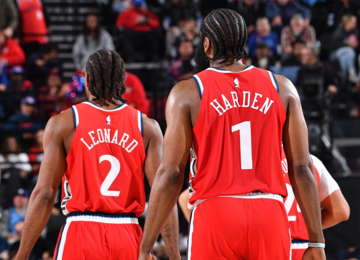 James Harden #1 and Kawhi Leonard #2 of the LA Clippers look on during the game against the Cleveland Cavaliers on March 18, 2025 at Intuit Dome in Los Angeles, California. Juan Ocampo, NBAE via Getty Images/AFP