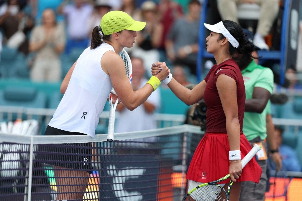 Iga Swiatek of Poland meets Alexandra Eala of the Philippines after losing to her on Day 9 of the Miami Open at Hard Rock Stadium on March 26, 2025 in Miami Gardens, Florida. Al Bello, Getty Images/AFP