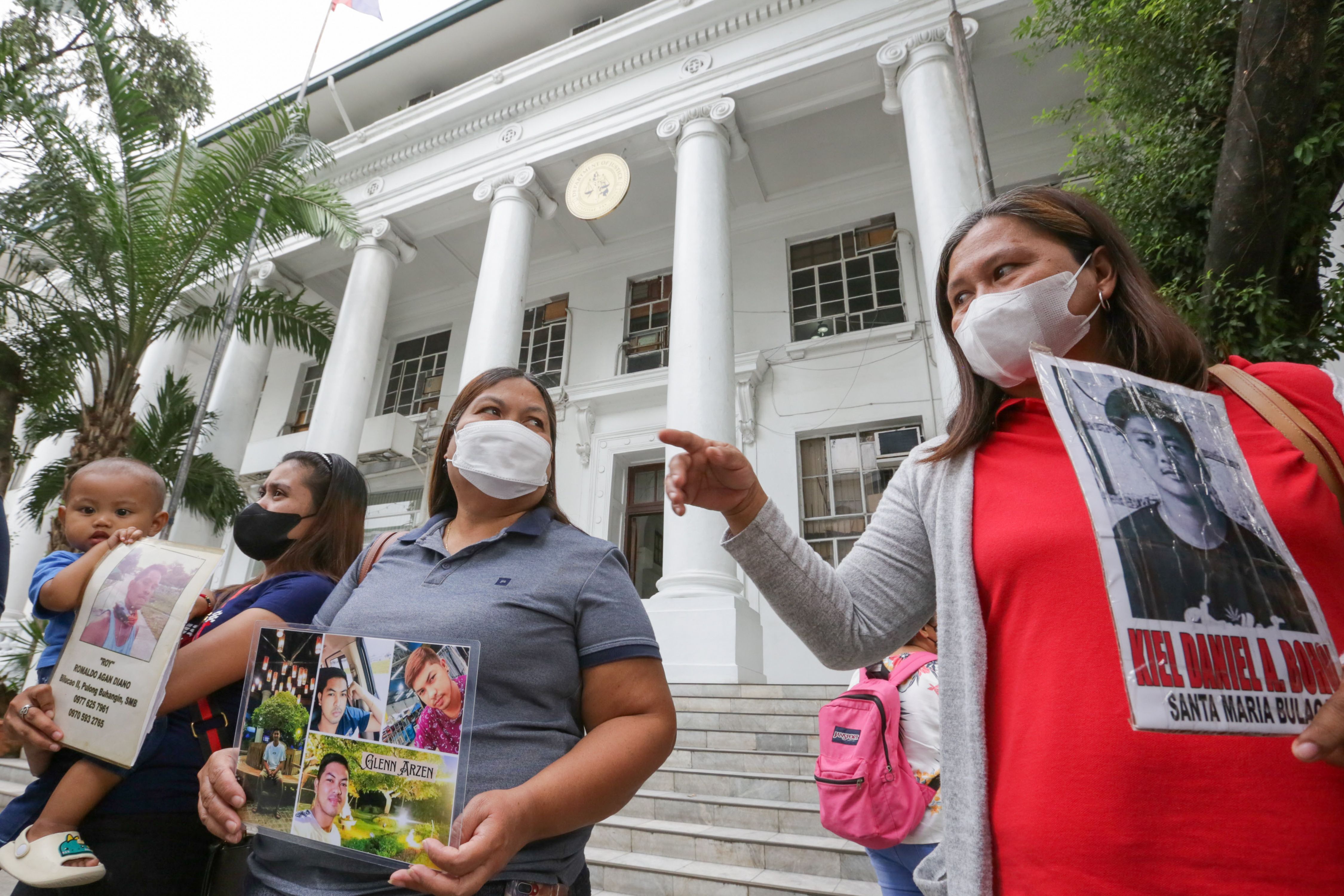 Relatives of missing sabungeros  exit the building after meeting with Justice Secretary Crispin Remulla in his office inside the Department of Justice on January 13, 2023. George Calvelo, ABS-CBN News/File
