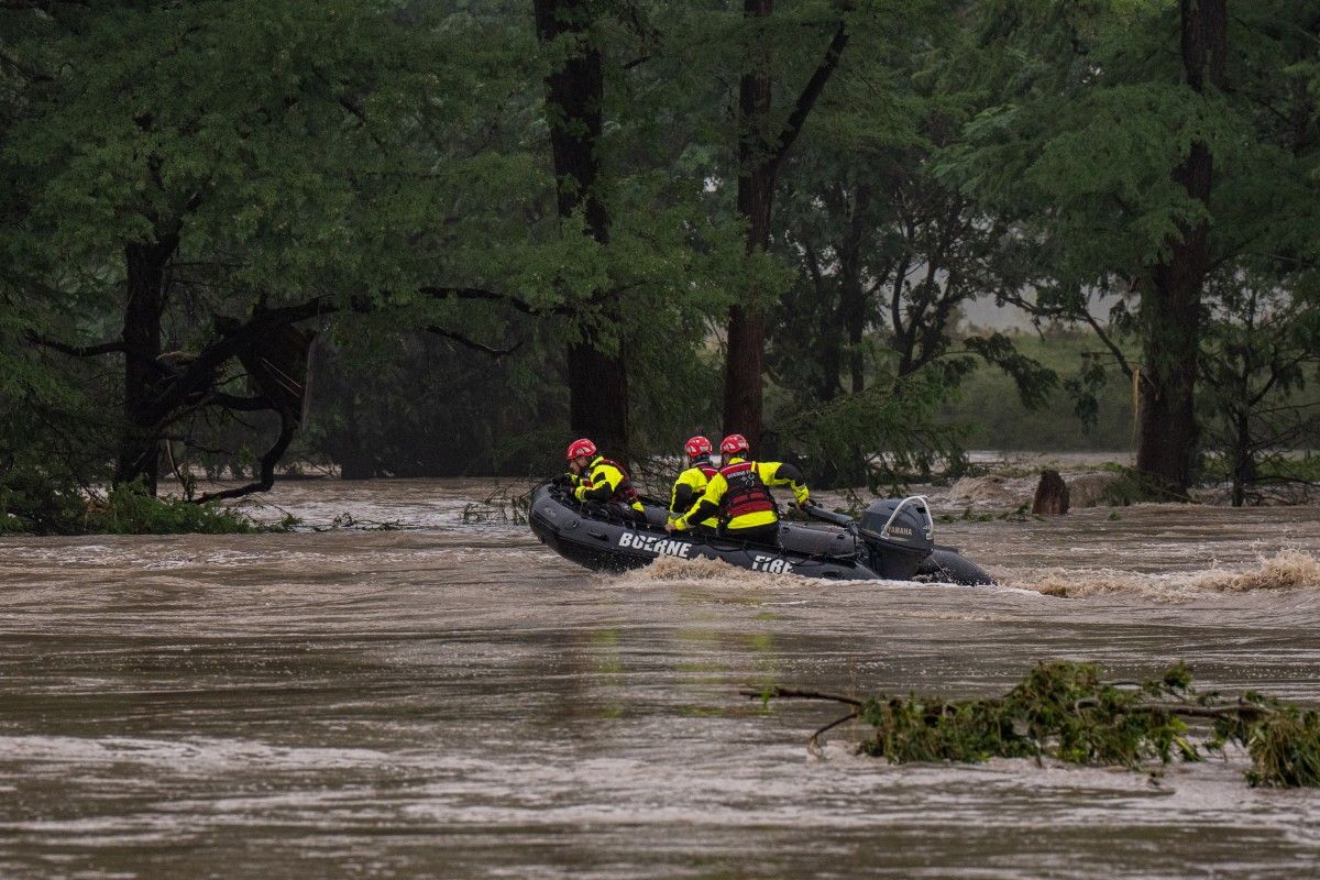 Boerne Search and Rescue teams navigate upstream in an inflatable boat on the flooded Guadalupe River on July 4, 2025 in Comfort, Texas. Heavy rainfall caused flooding along the Guadalupe River in central Texas with multiple fatalities reported. Eric Vryn, Getty Images/AFP