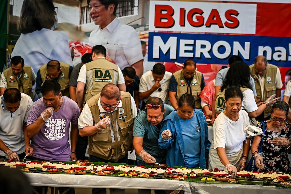 Agriculture Secretary Francisco Tiu Laurel Jr. joins farmers, stakeholders, and beneficiaries in a simple salu-salo at the KADIWA Center under the Benteng Bigas Meron (BBM) program at the Bureau of Animal Industry (BAI) compound in Quezon City on May 15, 2025. The event marks the first day of selling rice at ₱20 per kilo, promotes affordable rice access, and reaffirms the government’s support for local farmers. Maria Tan, ABS-CBN News/File