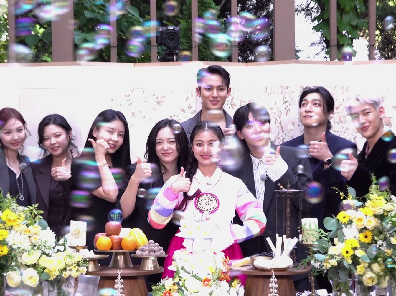 Jihyo of TWICE joined by her friends in the K-pop industry as she celebrates her 20th anniversary with her agency, JYP Entertainment. Screenshot from video on TWICE's YouTube channel