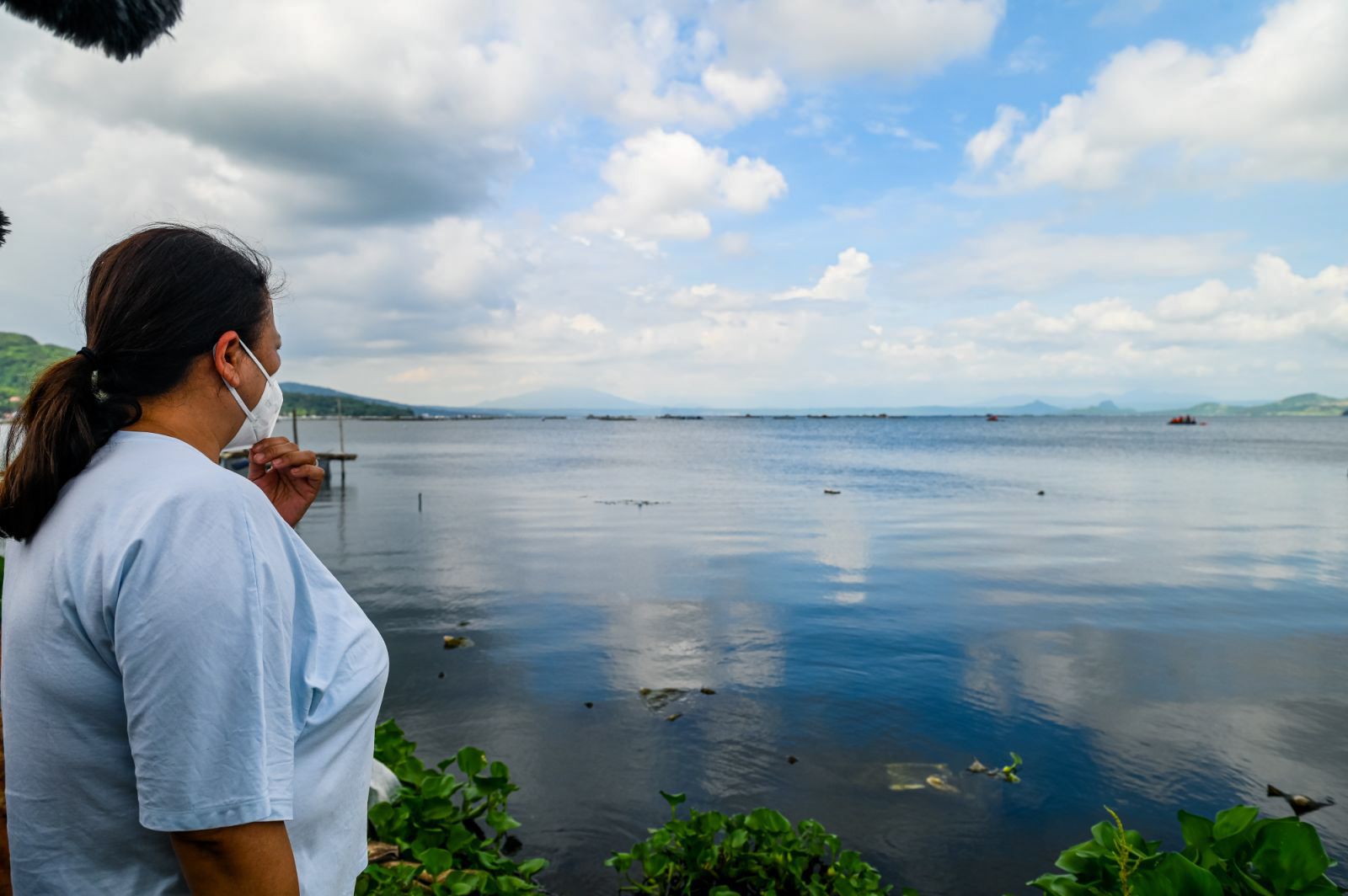 Relatives of the missing sabungeros turn emotional as they wait anxiously after authorities recovered suspected remains of the missing cockfighting enthusiast during the second day of search operations in Taal Lake, Laurel, Batangas, on Friday, July 11, 2025. Maria Tan, ABS-CBN News