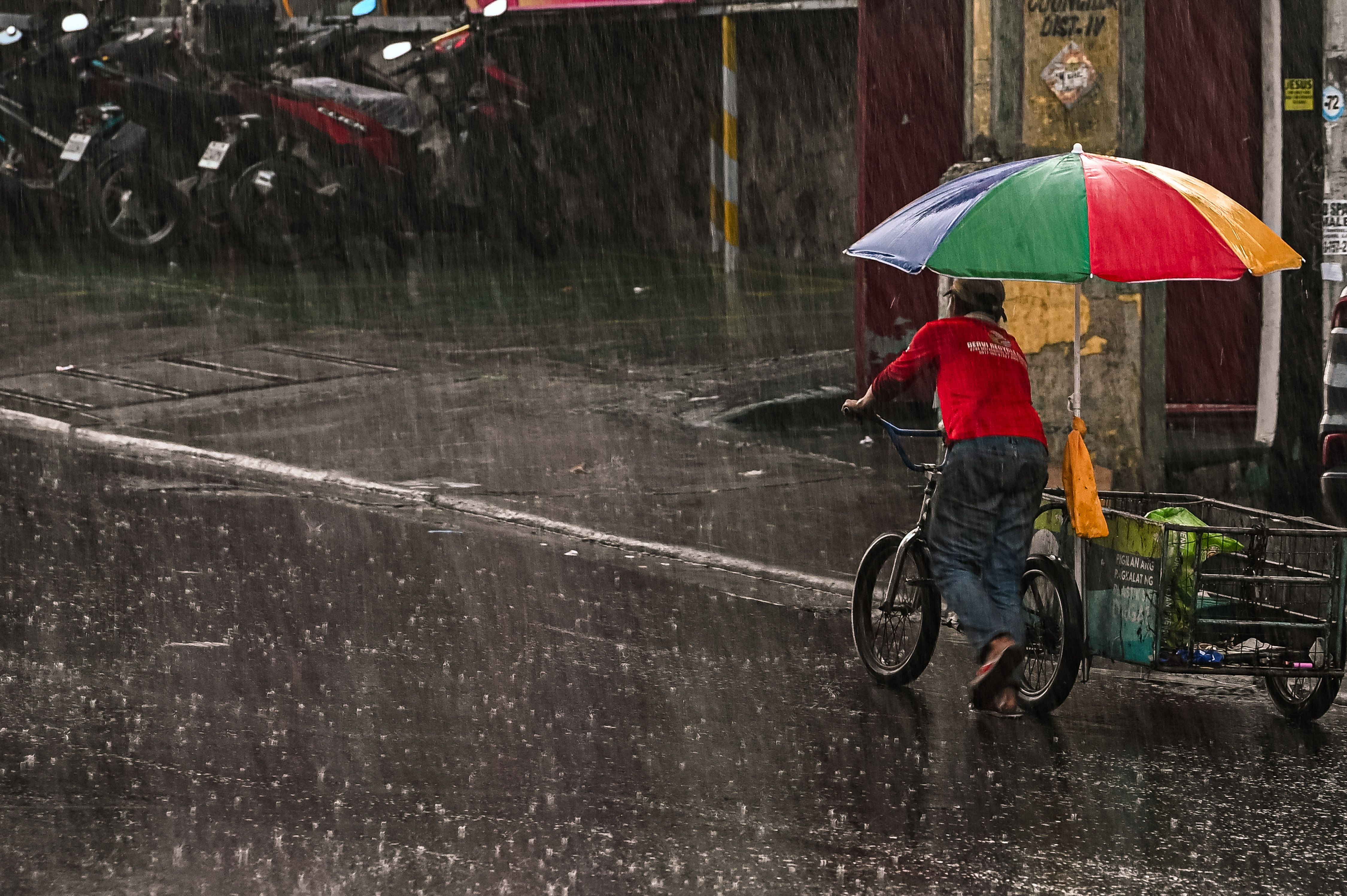 Motorists and pedestrians are caught in a sudden downpour in Quezon City on June 6, 2025. Maria Tan, ABS-CBN News