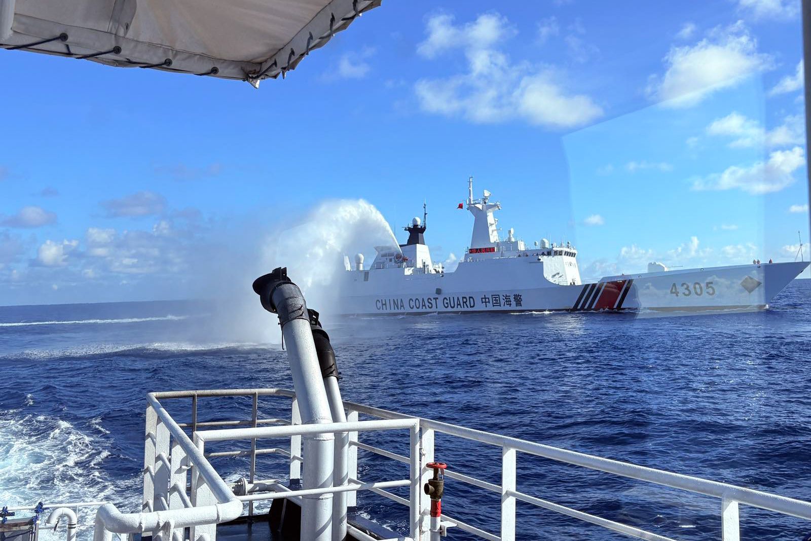 A China Coast Guard vessel fires water cannon at a Bureau of Fisheries and Aquatic Resources (BFAR) ship, August 11, 2025 near the Bajo de Masinloc or Scarborough Shoal. Bianca Dava, ABS-CBN News 