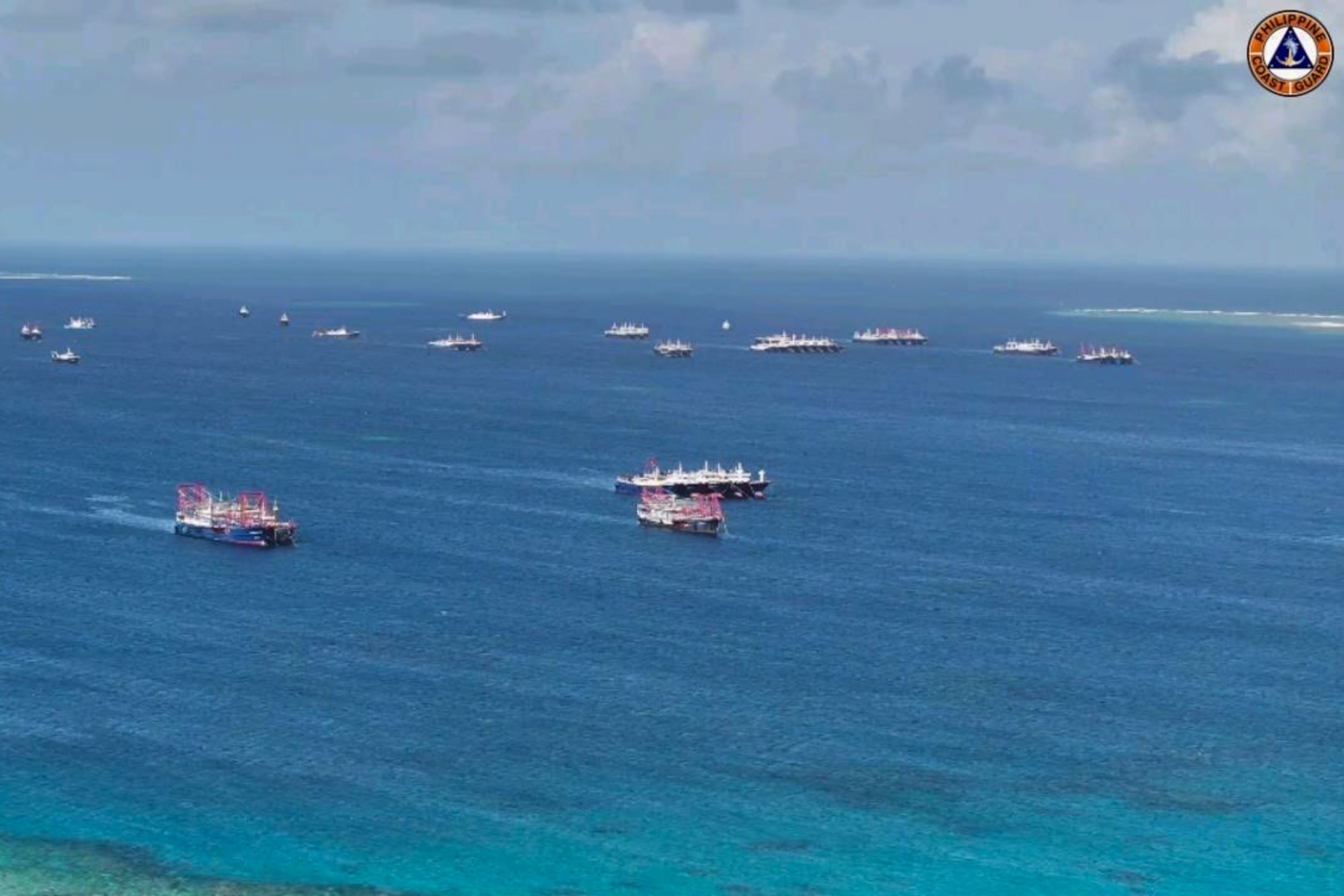 This photo issued by the Philippine Coast Guard (PCG) shows Chinese Maritime Militia (CMM) vessels swarming the area of Julian Felipe Reef taken December 2, 2023. The PCG raised concerns about the presence of at least 135 CMMs who did not respond to radio challenges by the PCG in the Julian Felipe Reed. These vessels began swarming in the area on November 13. Julian Felipe Reef, located 175 nautical miles west of Bataraza, Palawan, is a low tide elevation within the territorial sea of key high tide features in the Kalayaan Island Group, including Chigua Reef, over which the Republic of the Philippines has sovereignty. Photos courtesy of the Philippine Coast Guard 
