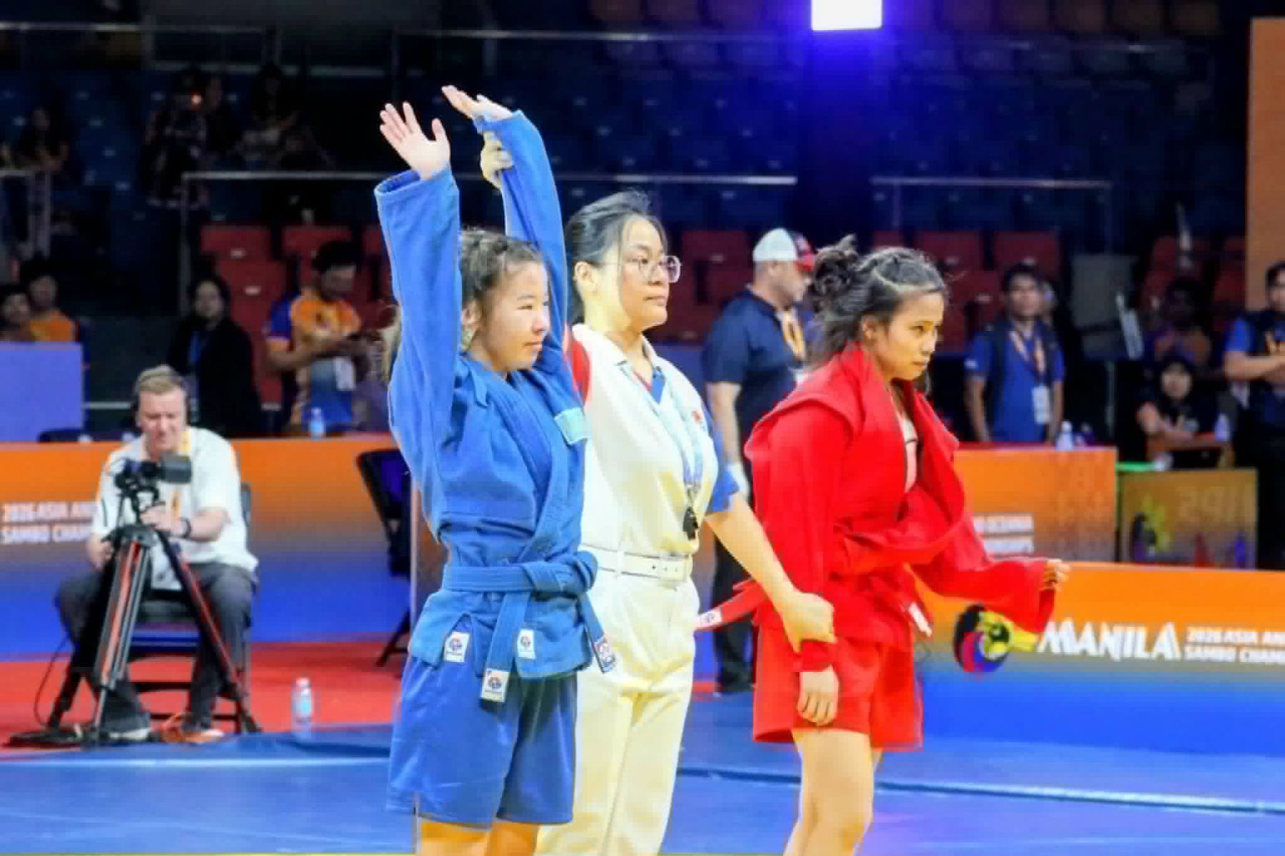 Kazakhstan's Karakat Rakhybay raises her hands in victory after beating Filipina grappler Sophia Nicole Novino in the final of the women's youth -47-kilogram division of the 11th Asia-Oceania Championships at the Ninoy Aquino Stadium, June 24, 2026. Handout/PSC