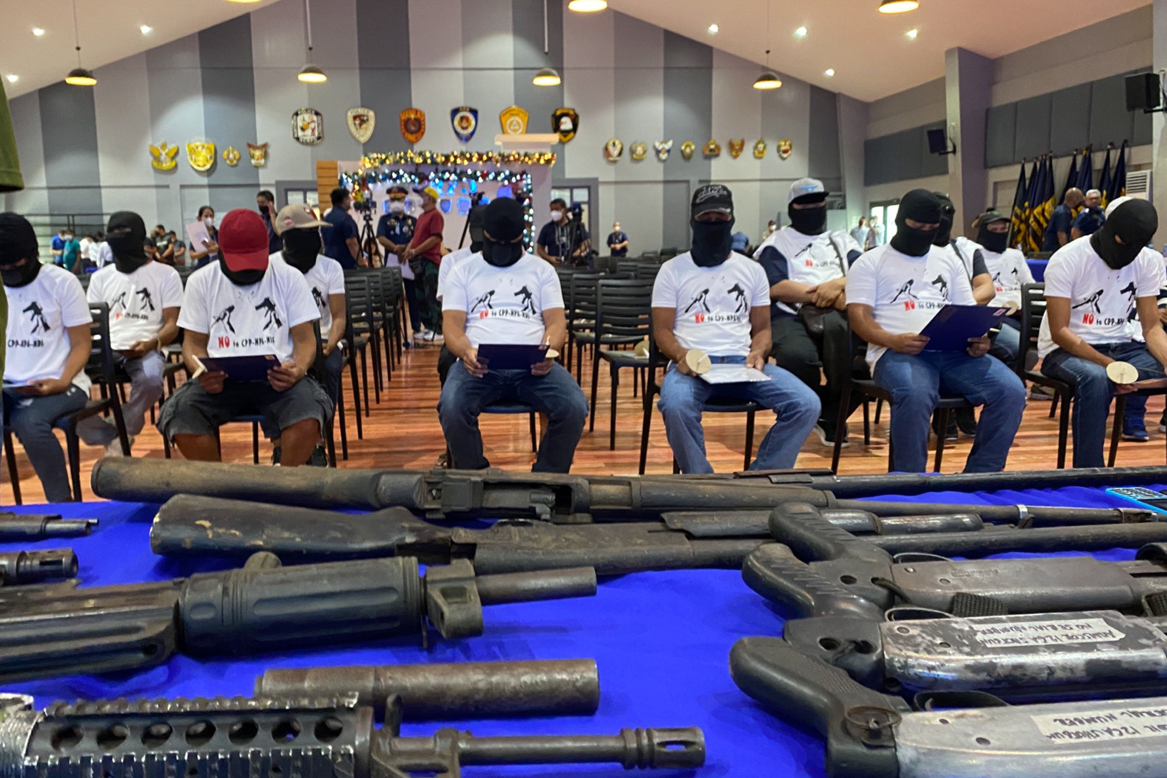 Photo shows alleged former members of the CPP-NPA-NDF as officers of the National Capital Region Police Office facilitate their surrender at Camp Bagong Diwa, Bicutan, Taguig on December 26, 2022. Jonathan Cellona, ABS-CBN News