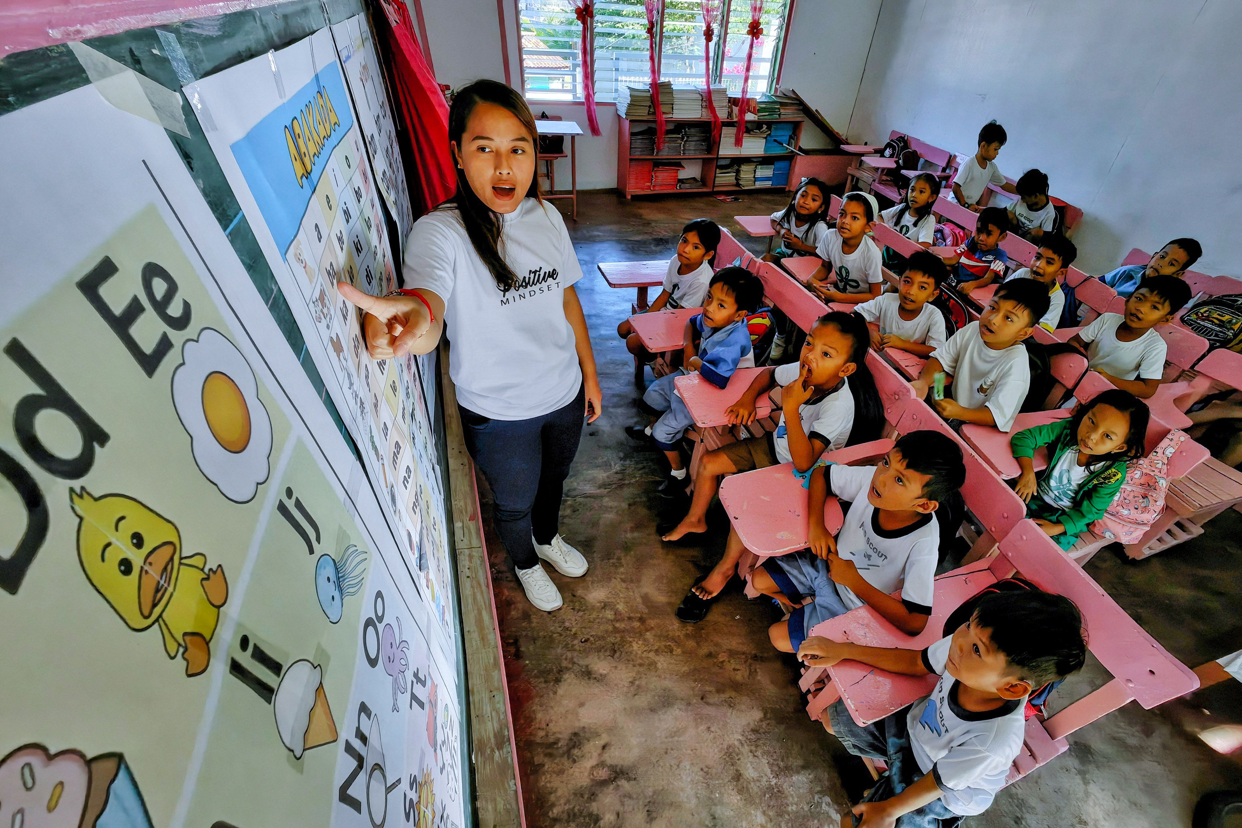A teacher leads reading activities during the implementation of 'Catch-up Fridays' at Papaya Elementary School in Nasugbu, Batangas on January 12, 2024. Domcar C. Lagto, ABS-CBN News