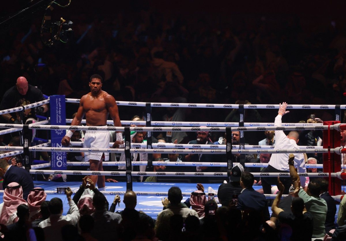 British boxer Anthony Joshua (L) celebrates after defeating Cameroonian-French boxer Francis Ngannou during their heavyweight boxing match in Riyadh's Kingdom Arena indoor stadium, on March 9, 2024. Fayez Nureldine, AFP.